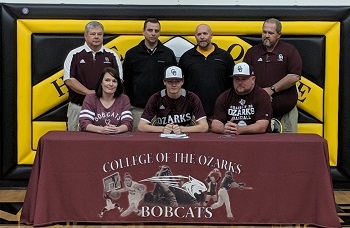 Michael White signing with Bobcat Head Coach Richardson-VanBuren Asst Coach Bryan Hawkins-Van Buren Head Coach J.C.Hoagland, Coach McMillin- Mom Mary-Michael-Dad Eric White