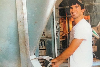 Worker filling grainbag
